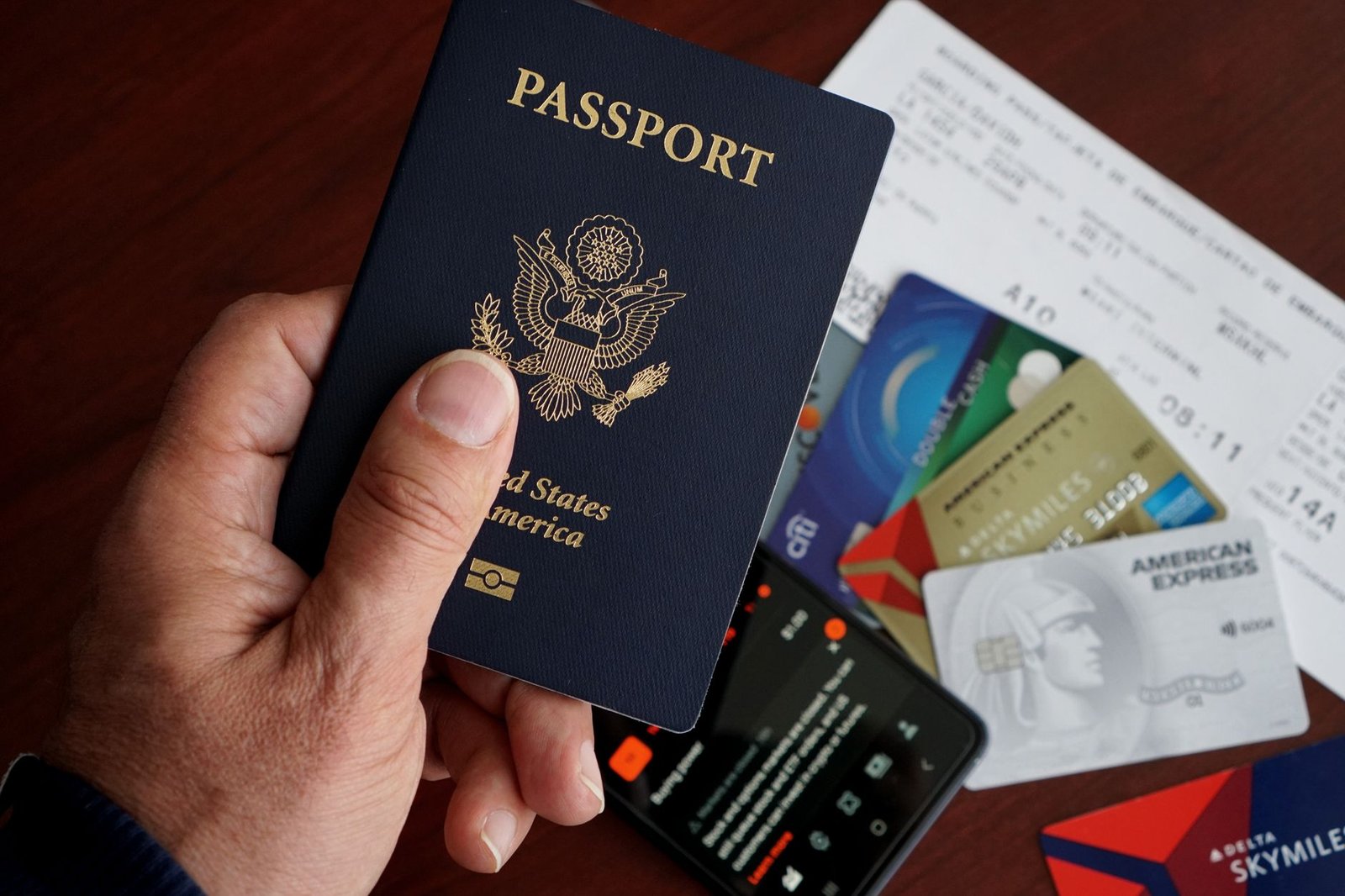 Travel documents and a credit card, which may already include limited trip coverage