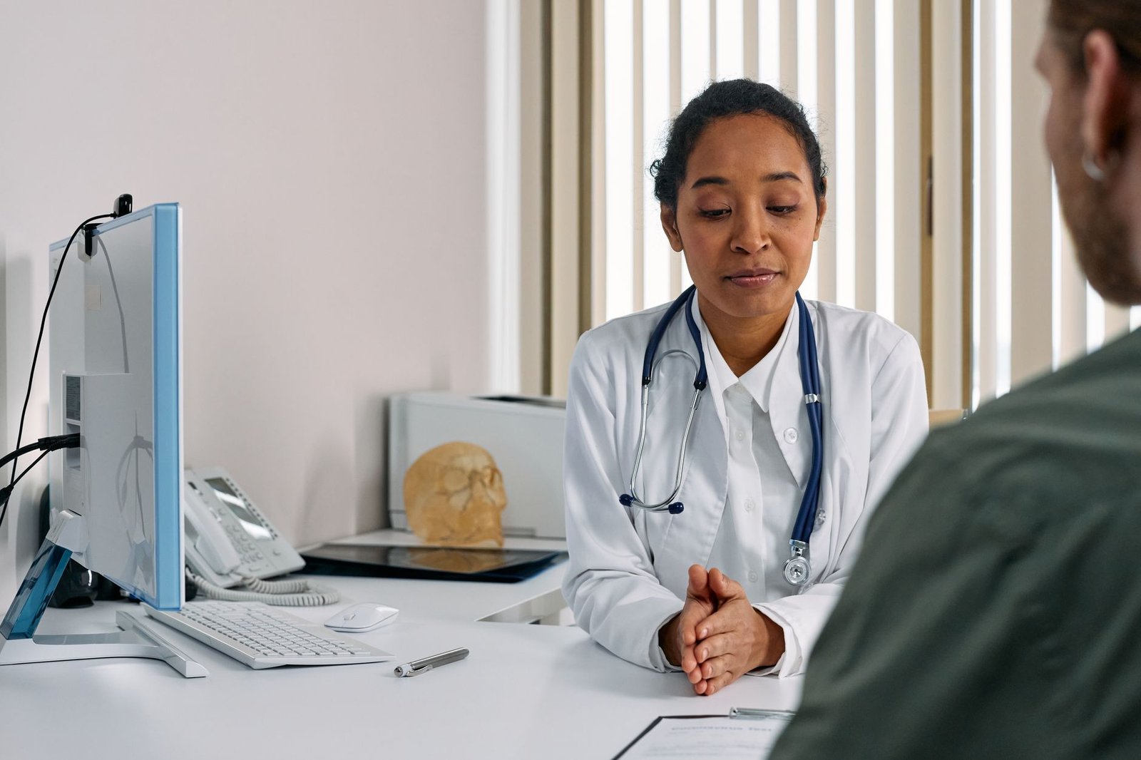 Doctor and patient, illustrating how health insurance works in the USA