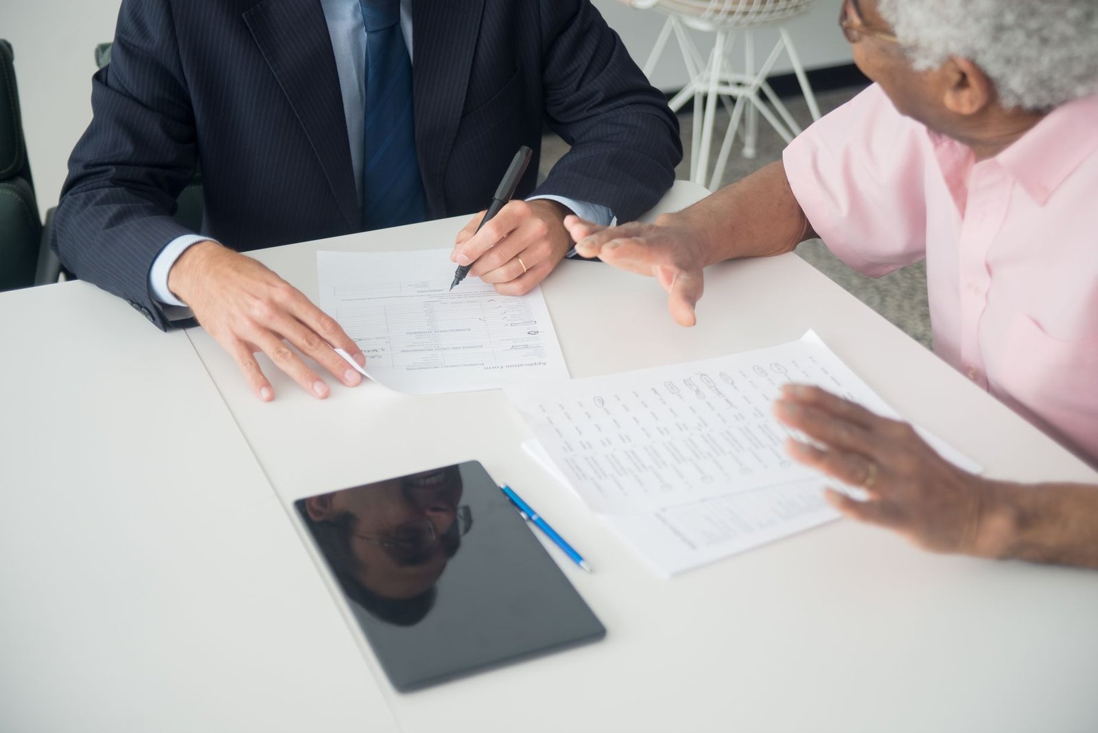 Reviewing umbrella insurance limits and underlying policy requirements with an agent