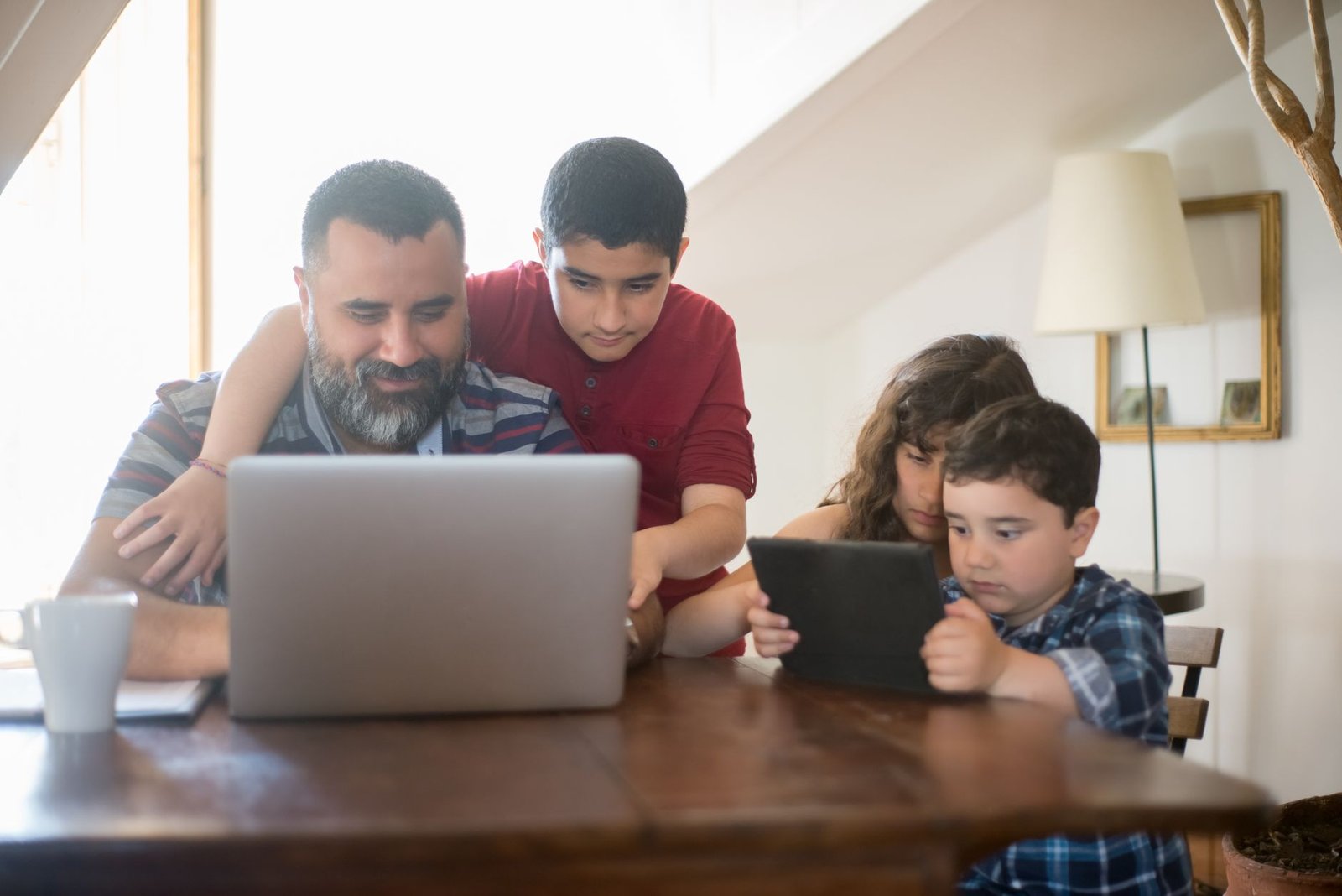 Family reviewing Obamacare ACA plan options on a laptop